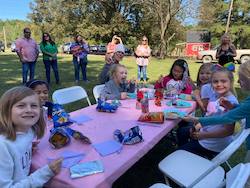 birthday party scene with kids at a table